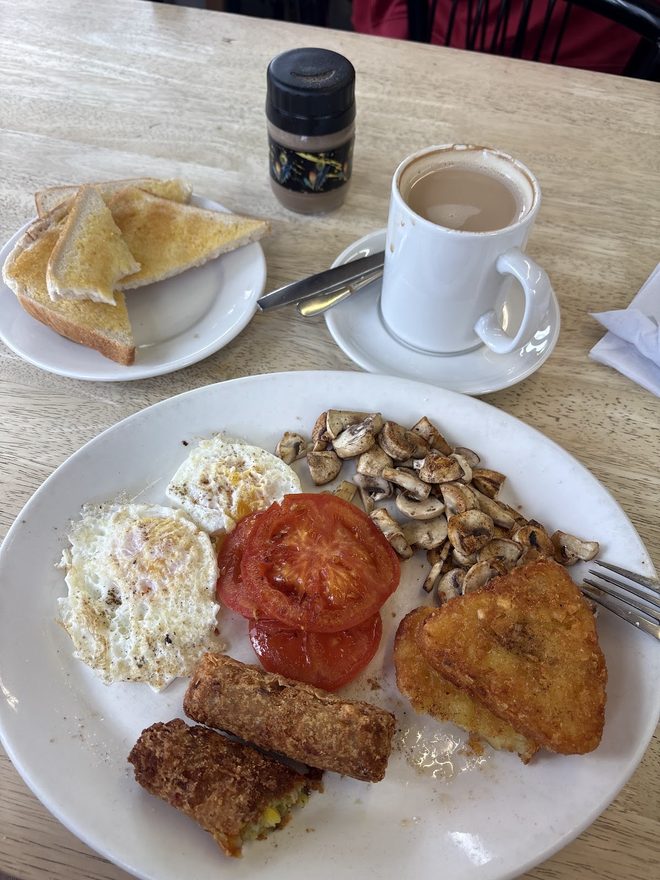 Vegetarian fry-up with buttered toast and tea